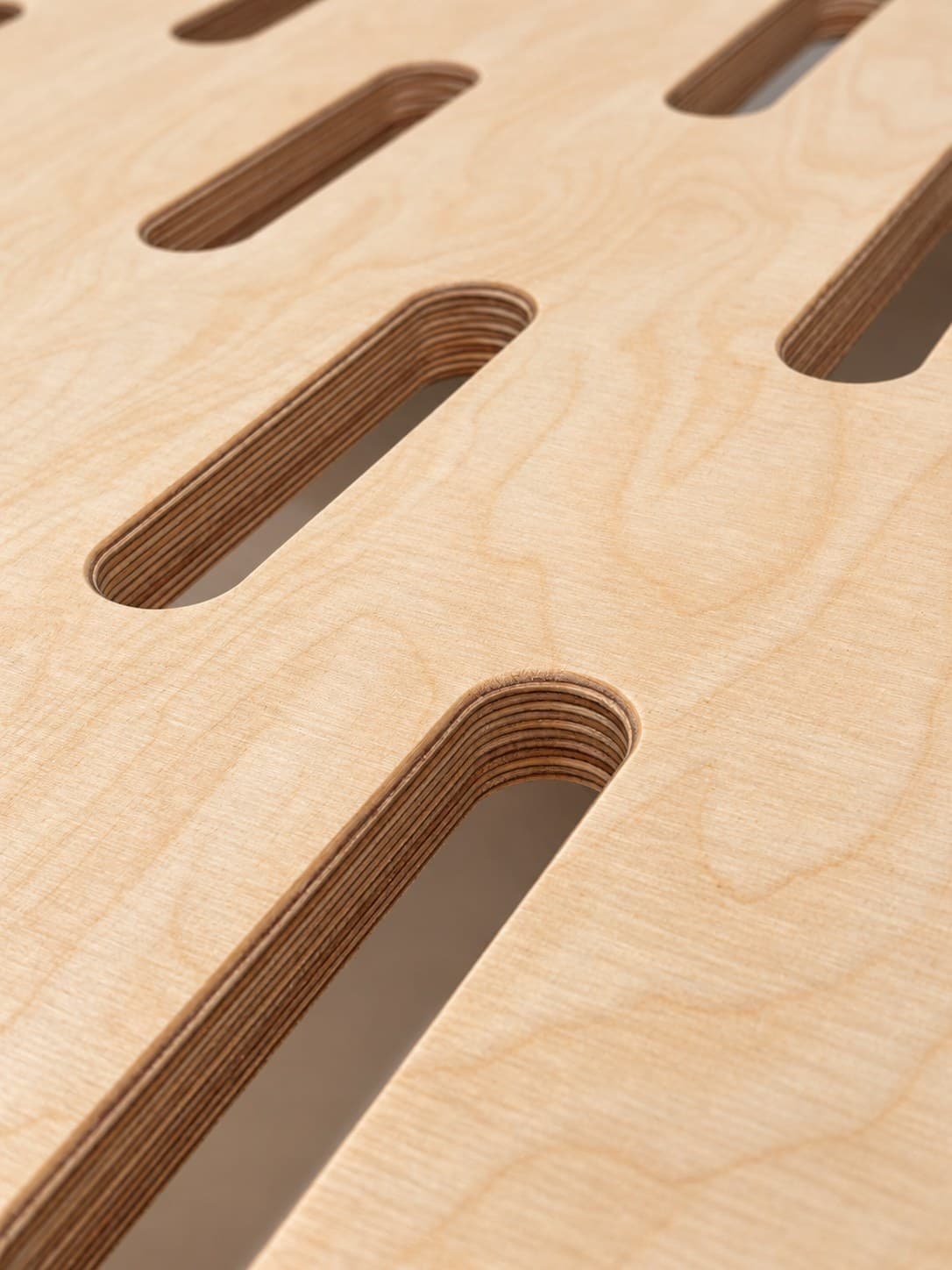 Detail of the glued plywood base board with ventilation openings