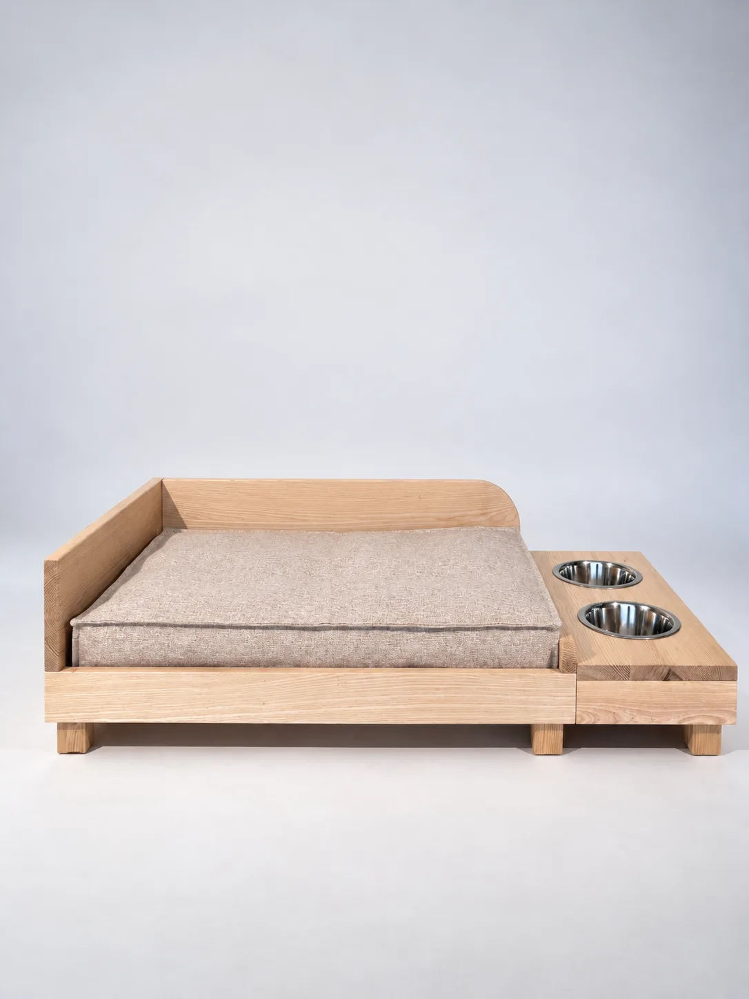 Akira dog bed with a rounded side, mattress and bowl module on the right